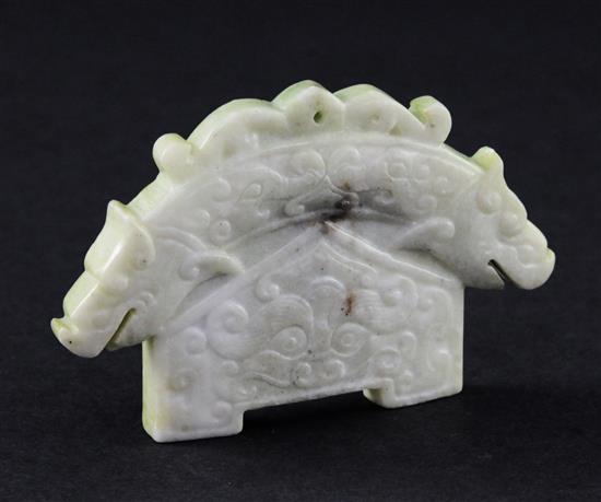 A Chinese jadeite archaistic double dragon plaque, 9.5cm